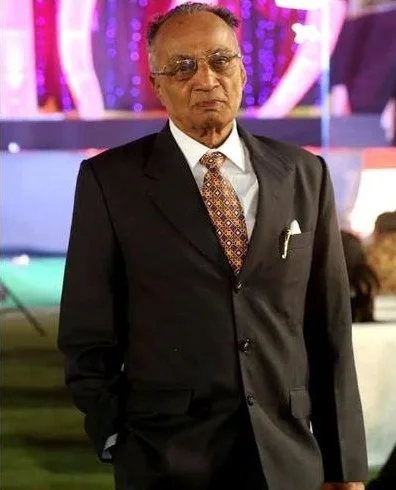 Founder of Greenstitch in formal attire